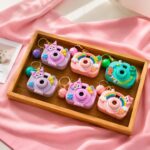 Mini Projection Camera Keychain for Kids (Pack of 6) Cute Cartoon Projector Toy Keyring with Bell Charm | Birthday Return Gift for Girls Boys | Party Favour Kanjak Navratri Gift Items | Kawaii Camera Key Chain